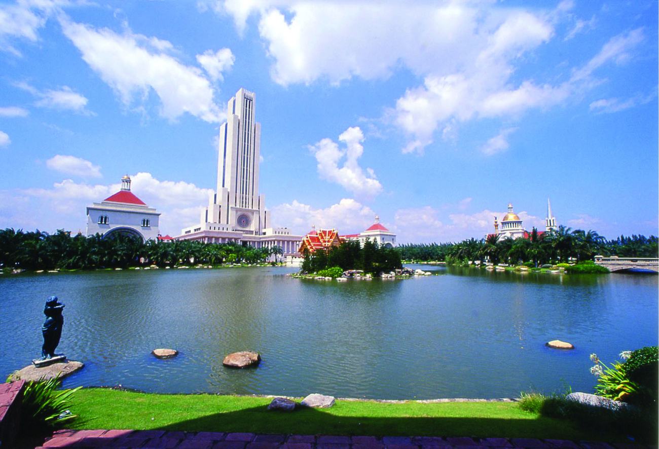 The Cathedral of Learning seen across the lake at the Suvarnabhumi campus